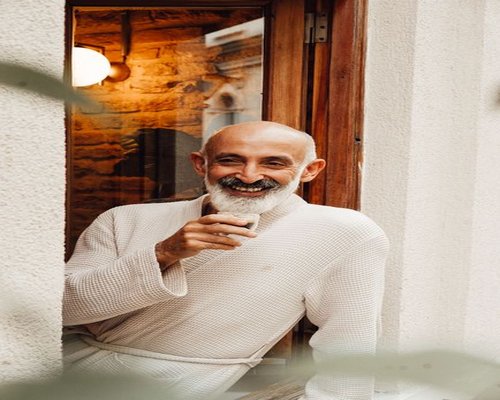 Man enjoying a quiet morning coffee in a Budapest apartment